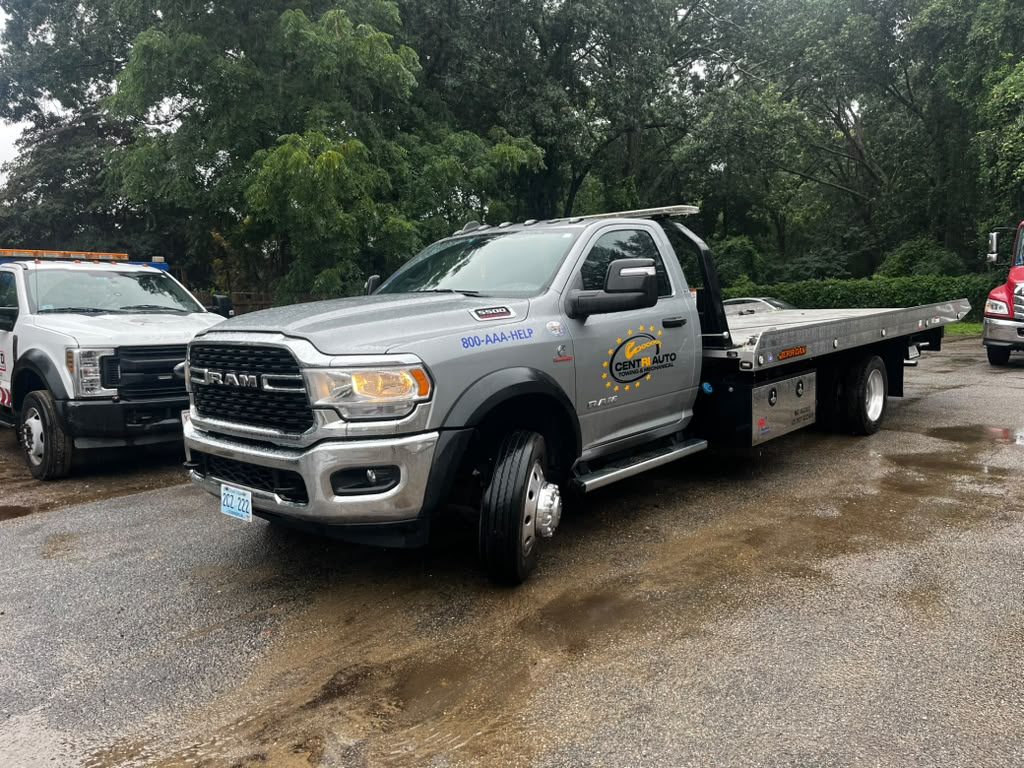 Centri Auto Towing flatbed truck with AAA roadside assistance decal