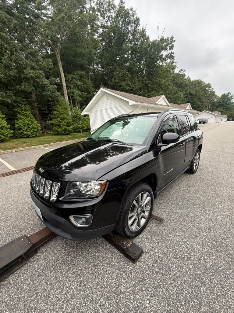 Black SUV loaded onto a Centri Auto flatbed tow truck