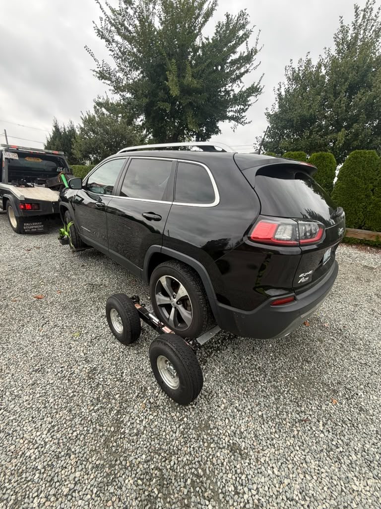 Jeep Cherokee on a tow dolly, rear view