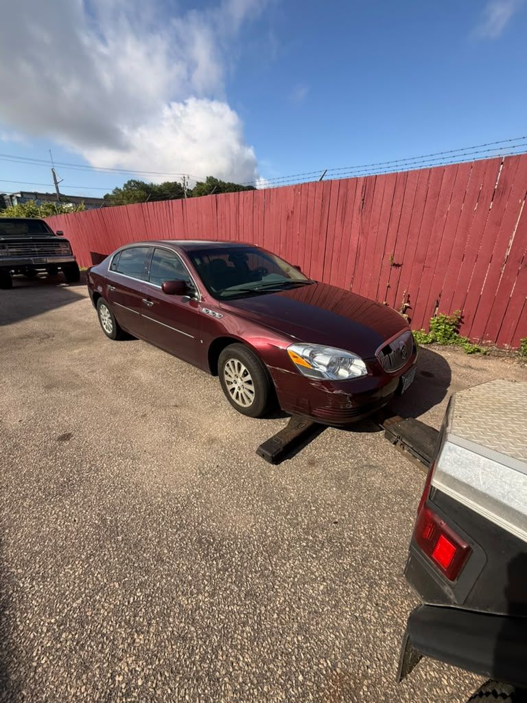 Sedan loaded onto a Centri Auto flatbed tow truck